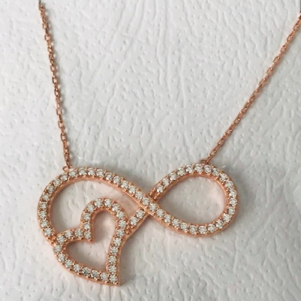 Rose gold infinity symbol with heart
